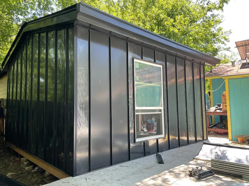 Black standing seam metal wall panels for Metal Roof Installation in Elgin