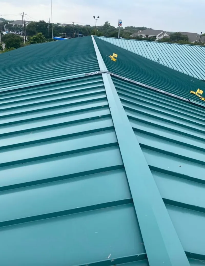 Green commercial metal roof ridge and valley for Metal Roof Repair in Elgin